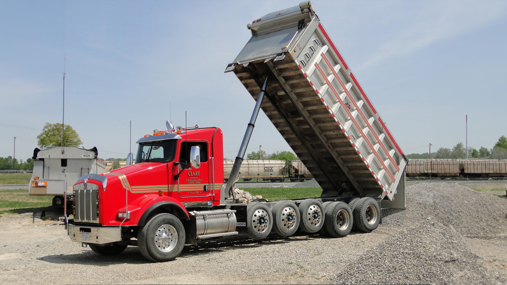Dump trailer hauling materials at Clary Trucking